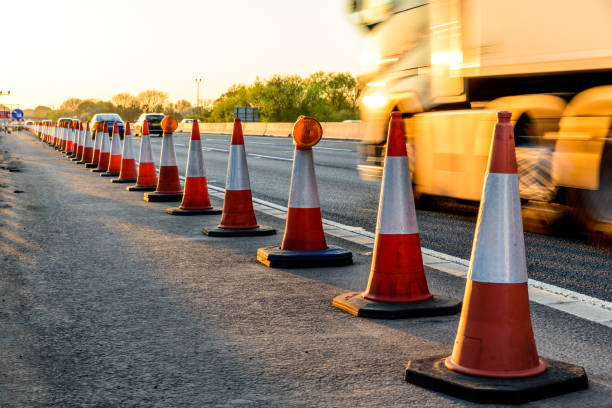 Evening view UK Motorway Services Roadworks Cones.